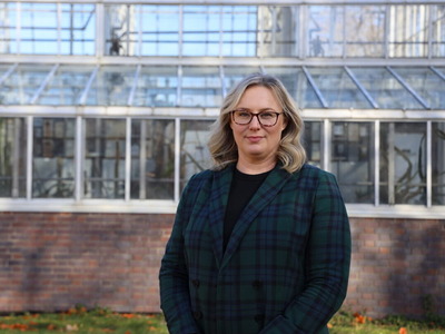 Jessica Davis stands in front of a building.
