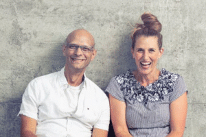 Kim Hellemans and Jim Davies, hosts of Minding the Brain podcast, pose together for a photo.