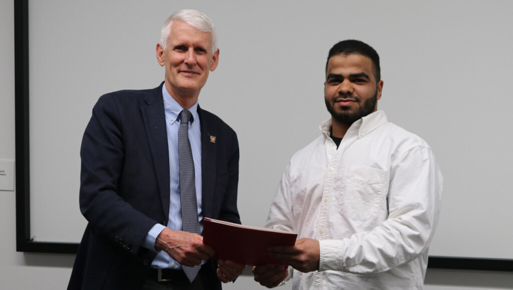 Mohamed Hozayen receives the Provost Scholar Awards from Provost and Vice-President (Academic) Jerry Tomberlin in April 2019