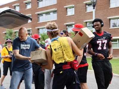 Volunteers help with move-in.
