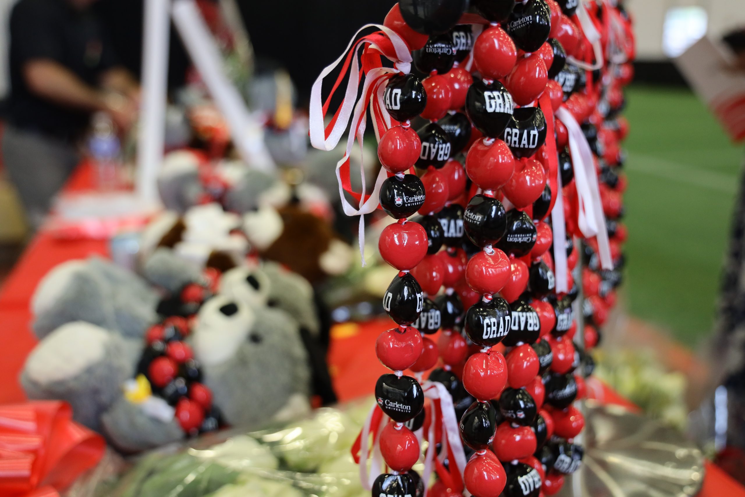 A photo of red and black Convocation branded balloons