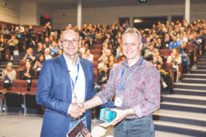 Prof. Godin (on the left) being presented with the Fry Medal by the President of the Canadian Society of Zoologist at its 2018 annual meeting.