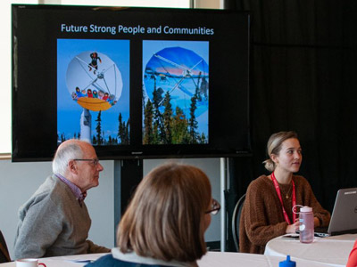A breakout group meets during one of the sessions.