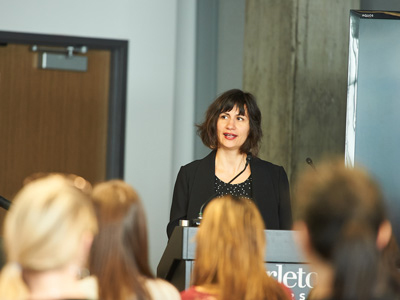 Prof. Sarah Everts speaks to a crowd at an opioid anti-stigma campaign.