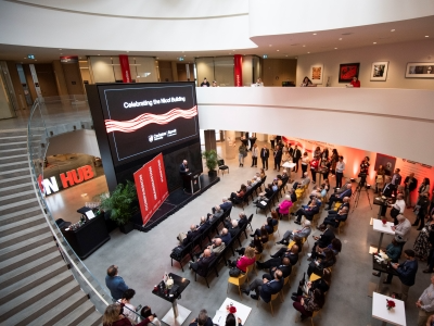 Birds eye view of the Nicol Building atrium filled with people during the opening event.