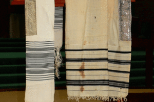 A photo of Les Grumach’s father's Tallit that was burned during Kristallnacht.