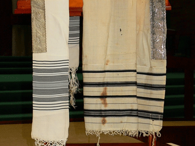 A photo of Les Grumach’s father's Tallit that was burned during Kristallnacht.