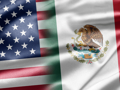 An image of the flags of the United States and Mexico.