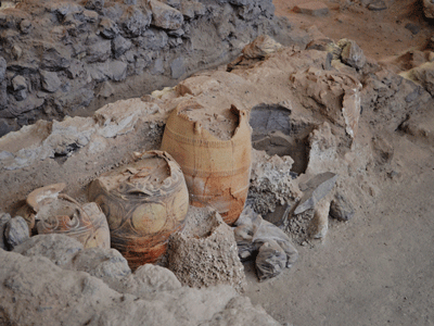A photo of vessel artifacts at an excavation site.