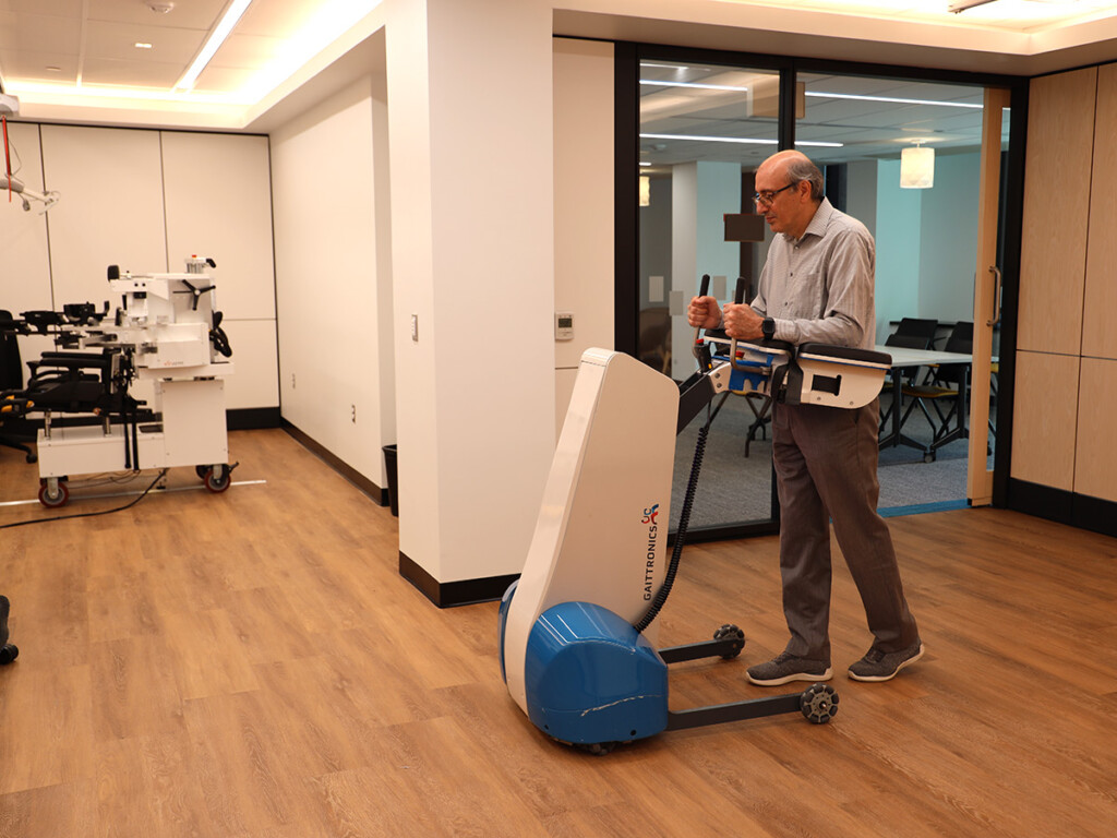 A man uses a piece of equipment inside the the Abilities Living Laboratory.