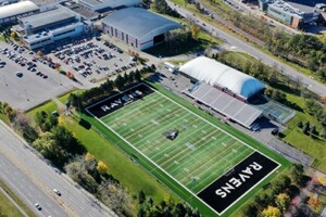 An aerial shot of the Carleton University campus. The football field can be seen with the word Ravens in the end zone.