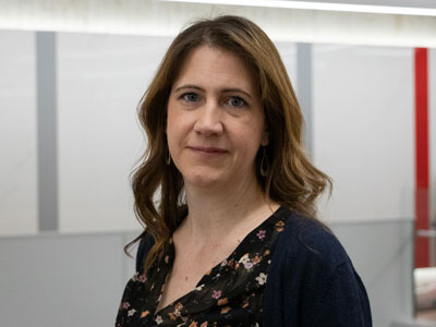 A headshot of Anita Grace in the lobby of Robertson Hall.