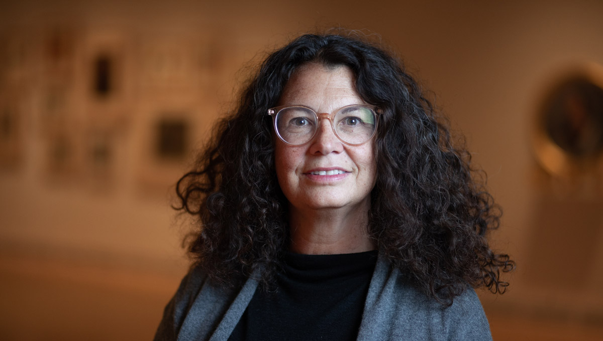 A headshot of Carmen Robertson in the Carleton University Art Gallery
