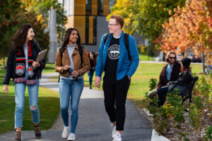Students walking and talking on campus