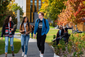 Students walking and talking on campus