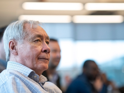 Tony Bailetti sits in a conference room listening to a presentation.