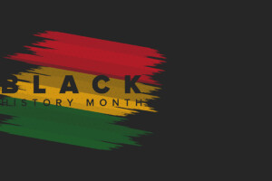 The words 'Black History Month' appears over splashes over colour including red, yellow, and green.