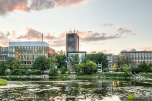 Campus is viewed from the shore of the Rideau river