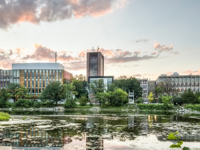 Campus is viewed from the shore of the Rideau river