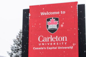 A snow-covered sign reading 