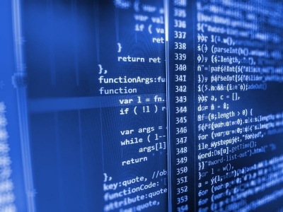 Computer code is displayed on a digital screen.