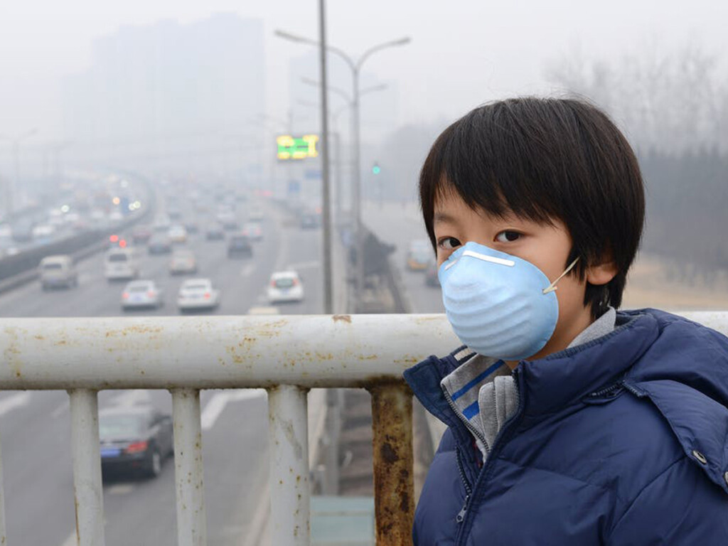 A child in Beijing, China wearing a surgical mask.