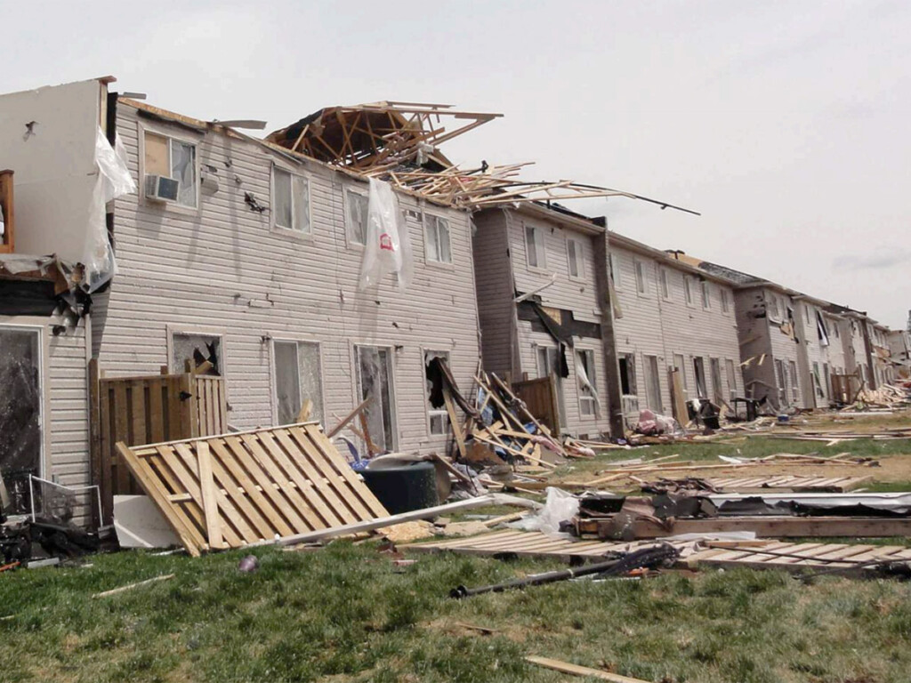 A row of damaged homes
