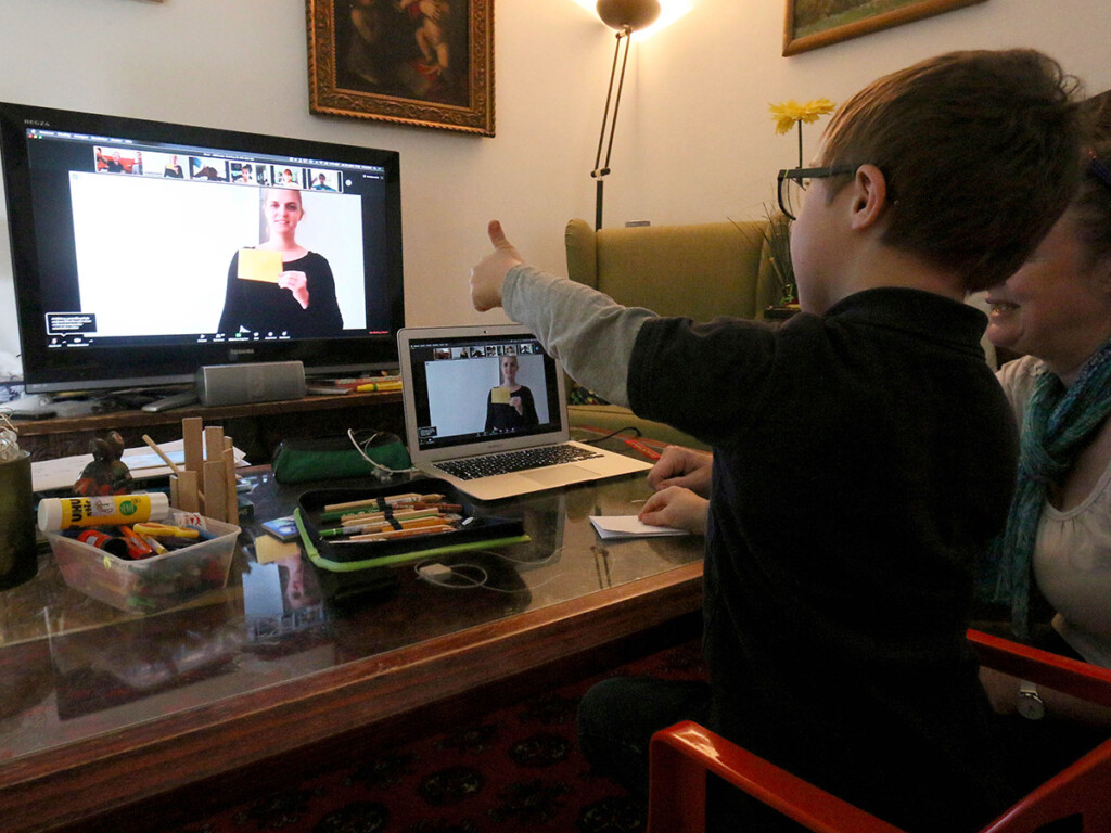 Elementary school student Adrian Zak works with his teacher online in Vienna, Austria, March 25, 2020. The Austrian government has restricted freedom of movement for people in an effort to slow the spread of COVID-19. (AP Photo/Ronald Zak)