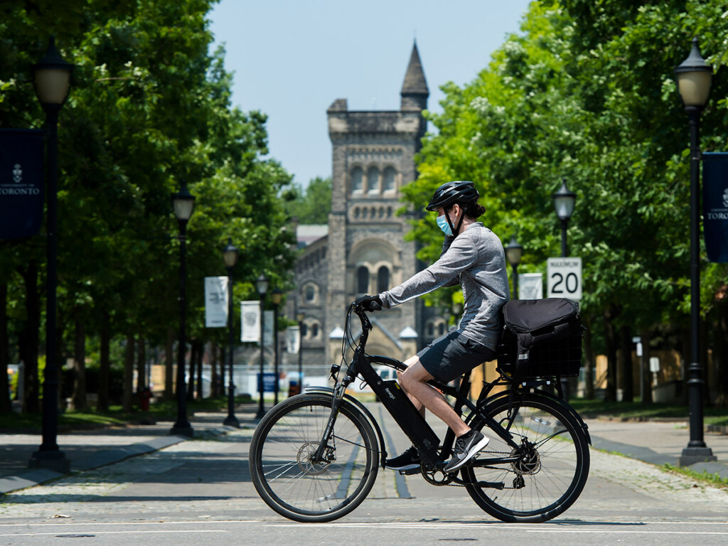 A lone cyclist rides past the University of Toronto campus during the COVID-19 pandemic in Toronto on June 10, 2020. (THE CANADIAN PRESS/Nathan Denette)