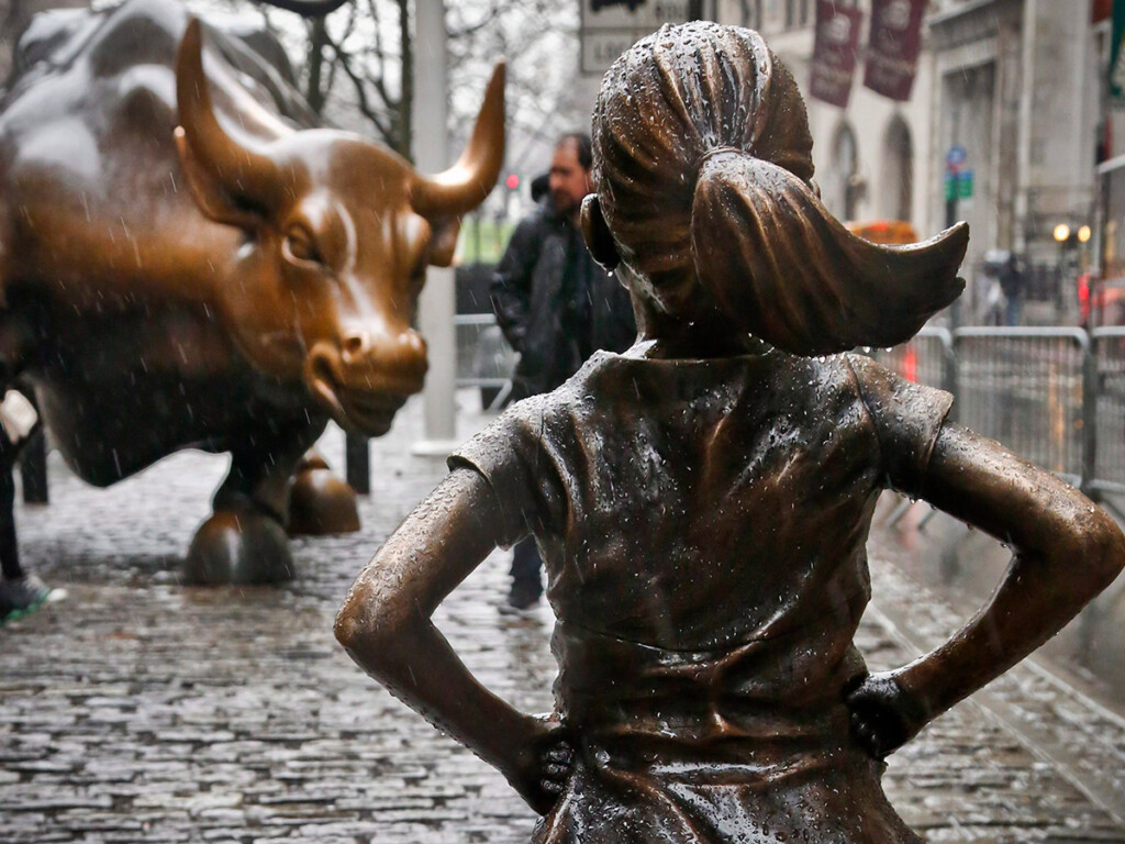 The Fearless Girl statue stands across from the Charging Bull statue in New York’s financial district. (AP Photo/Bebeto Matthews)