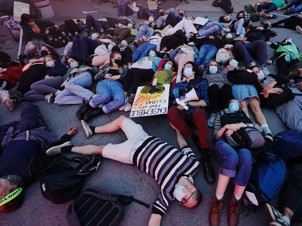 Climate activists protest outside of the first French leaders’ debate in Montréal, Que. on Sept. 2, 2021