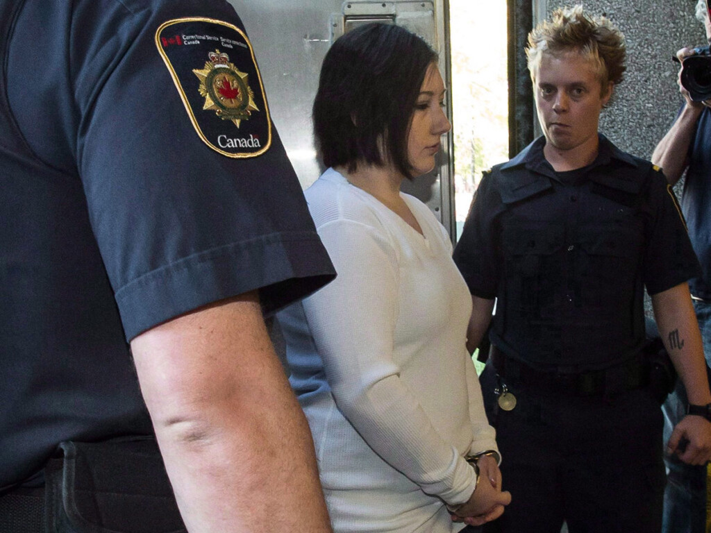 Terri-Lynne McClintic, convicted in the death of an eight-year-old girl, is escorted into court in Kitchener, Ont., in September 2012.