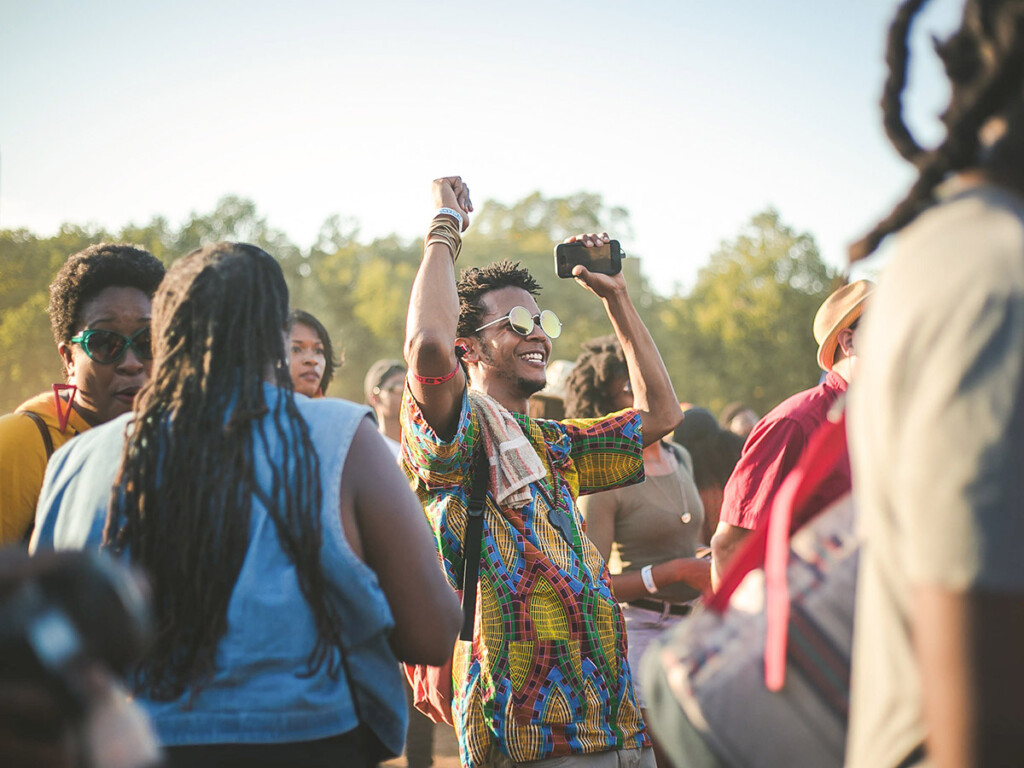 A young man dances at a music festival