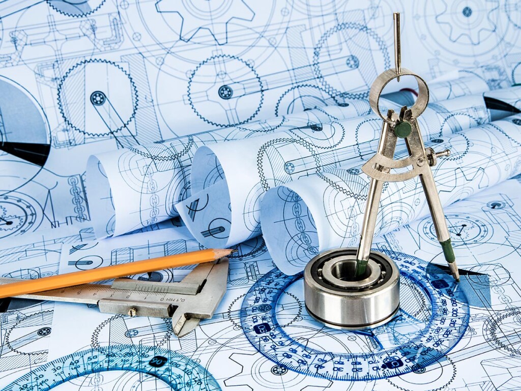 A compas and pencil sitting on a map