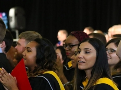 Graduates enjoy their convocation ceremony in the University Fieldhouse