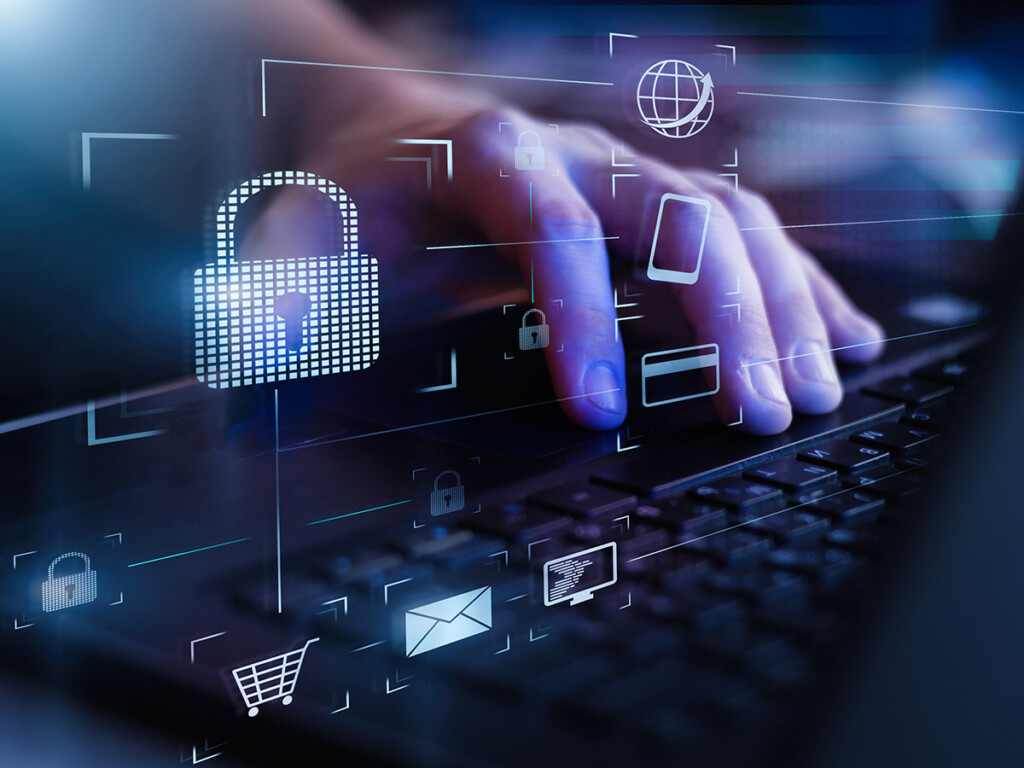 Closeup view of hands using laptop with virtual digital screen with icon of lock on it