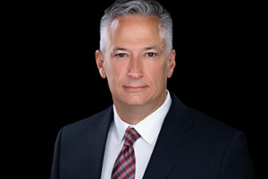 A professional photo of a man dressed in a business suit.
