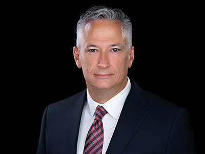 A professional photo of a man dressed in a business suit.