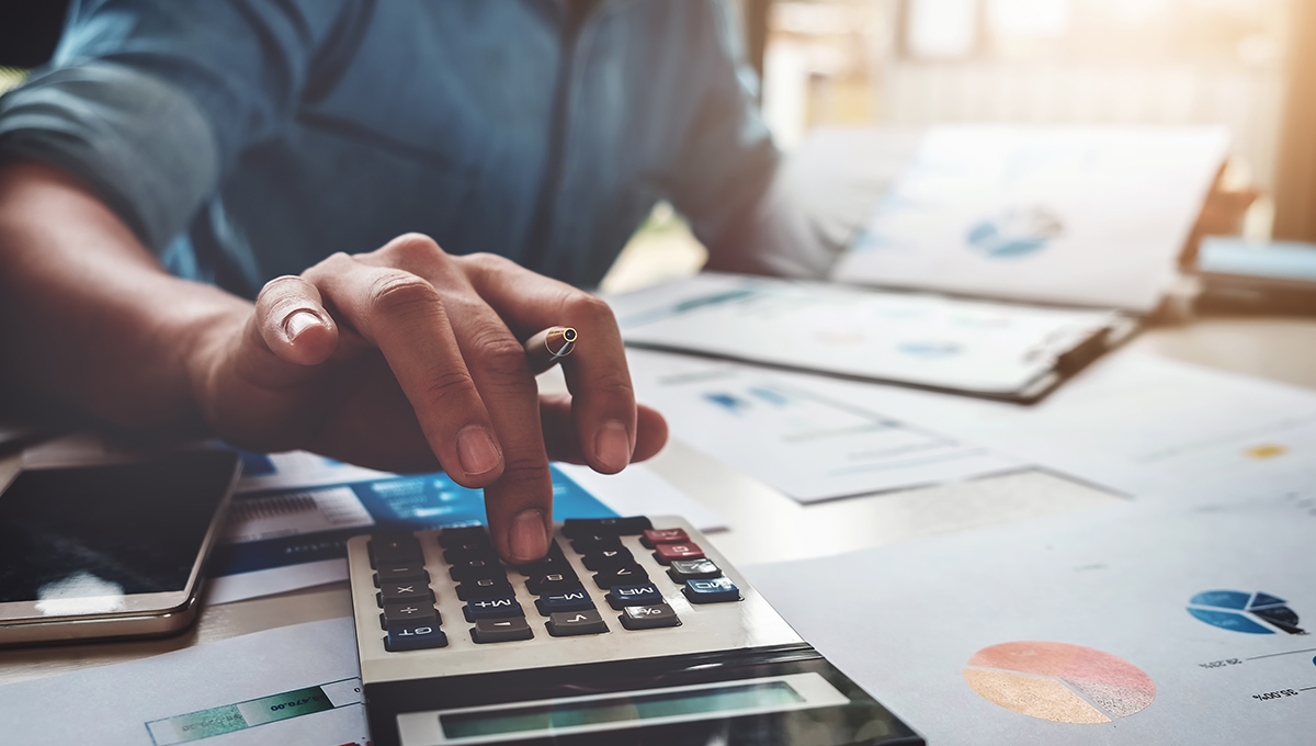 An accountant using a calculator