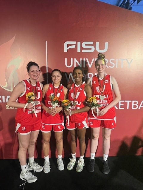 FISU winners pose with their medals.