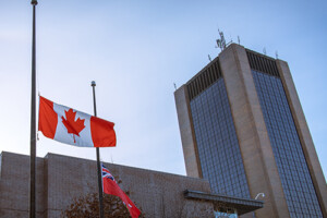 Flag at half mast with Dunton Tower visible in the background