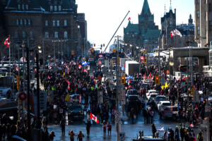People and vehicles fill Wellington Street near Parliament Hill at the beginning of the so-called freedom convoy occupation of Ottawa in late January, 2022. THE CANADIAN PRESS/Justin Tang