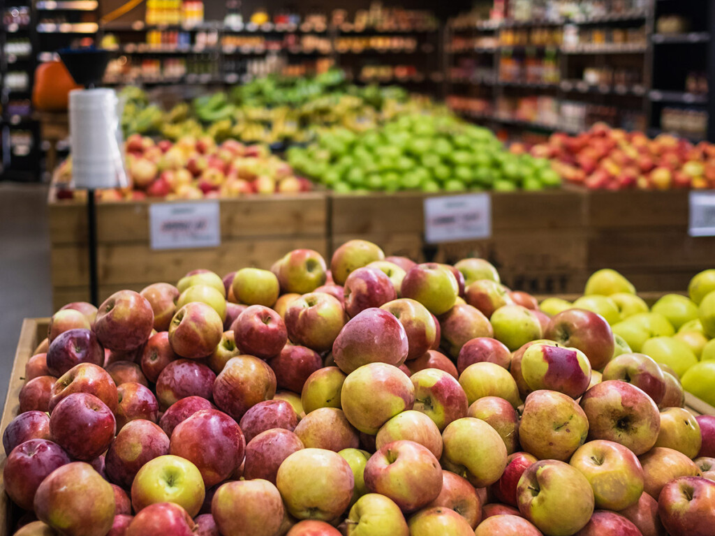 Various types of fruit on display inside a grocery store