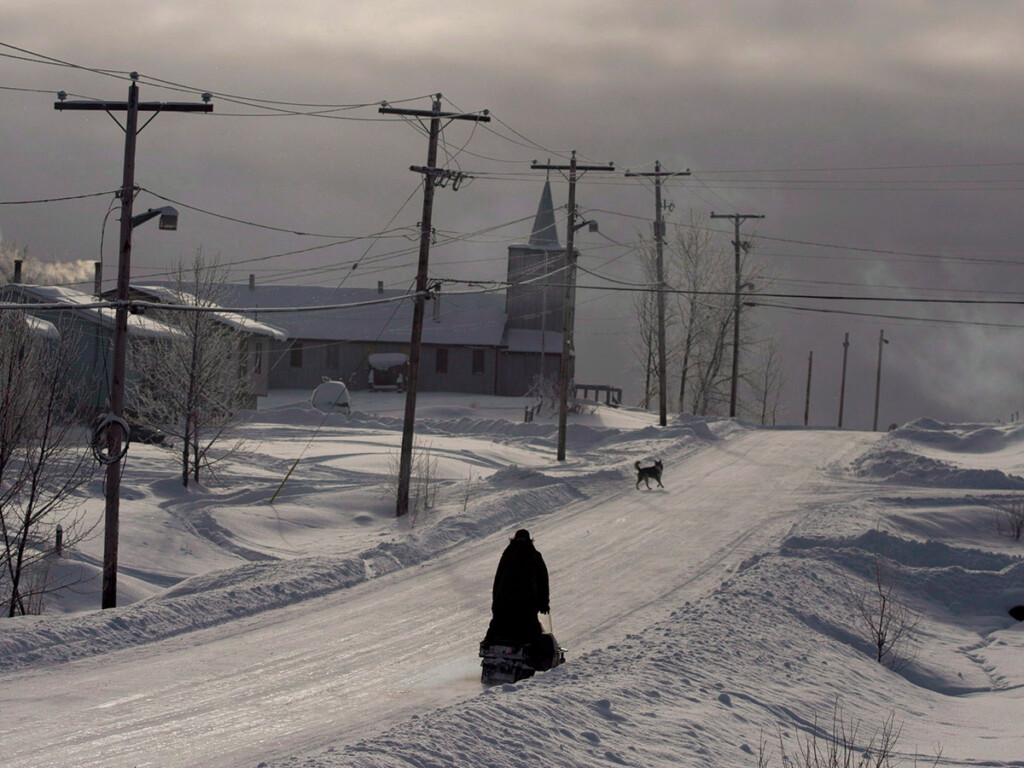 A woman seen walking in Eabametoong First Nation (THE CANADIAN PRESS/Ryan Remiorz)