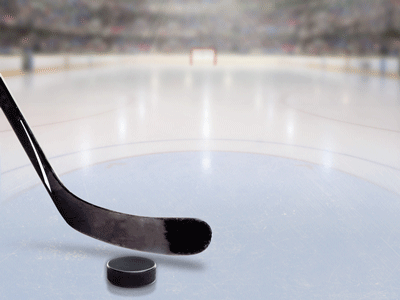 An image of a hockey puck and stick on ice.