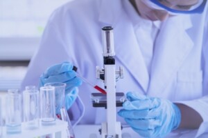 a scientist examining a vaccine in a lab