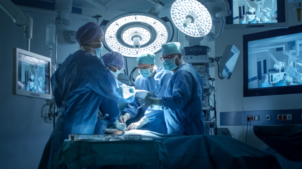 medical team performing surgery in operating room