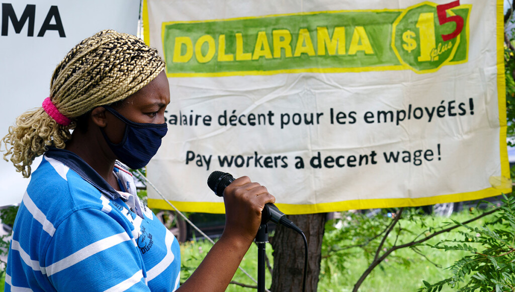 Dollarama worker Ze Carole Benedict, originally from Cameroon, addresses a demonstration in Montréal in August 2020 to join in calls for higher pay and better working conditions amid COVID-19. (THE CANADIAN PRESS/Paul Chiasson)