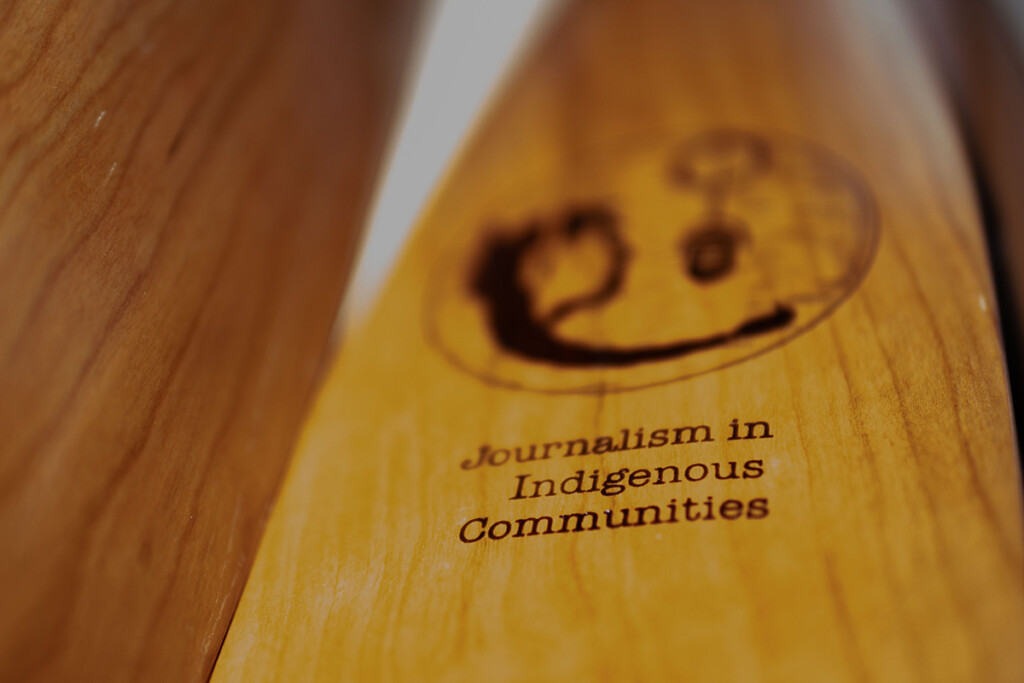 An oar with engravings.