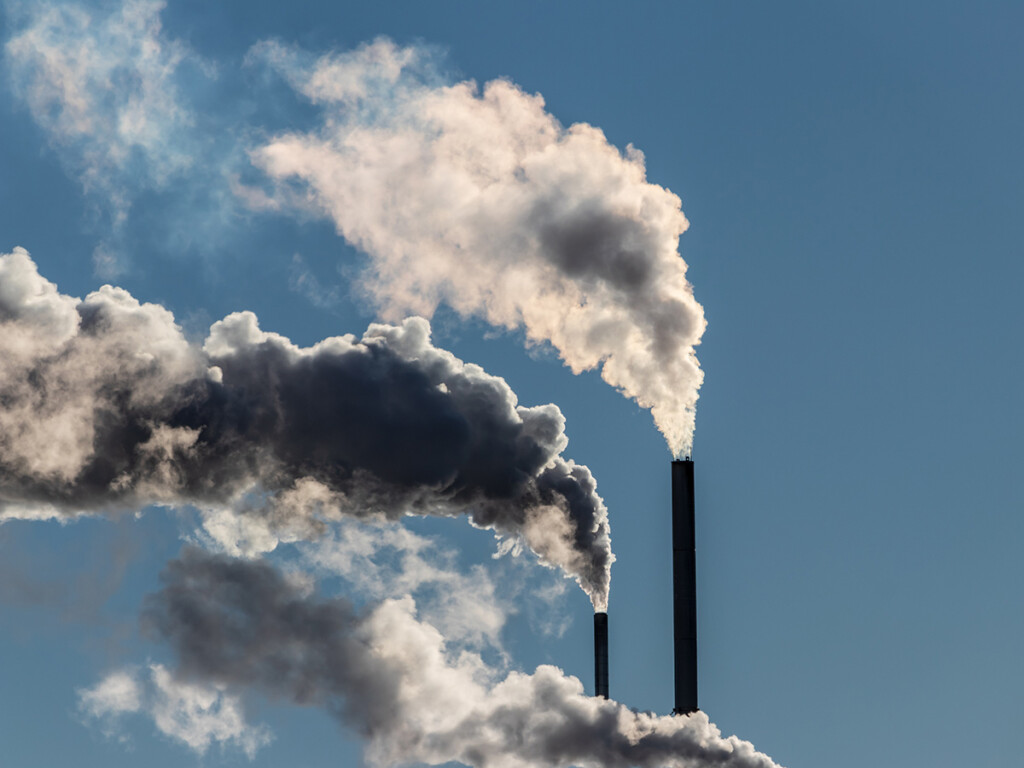 Factory stacks releasing emissions.